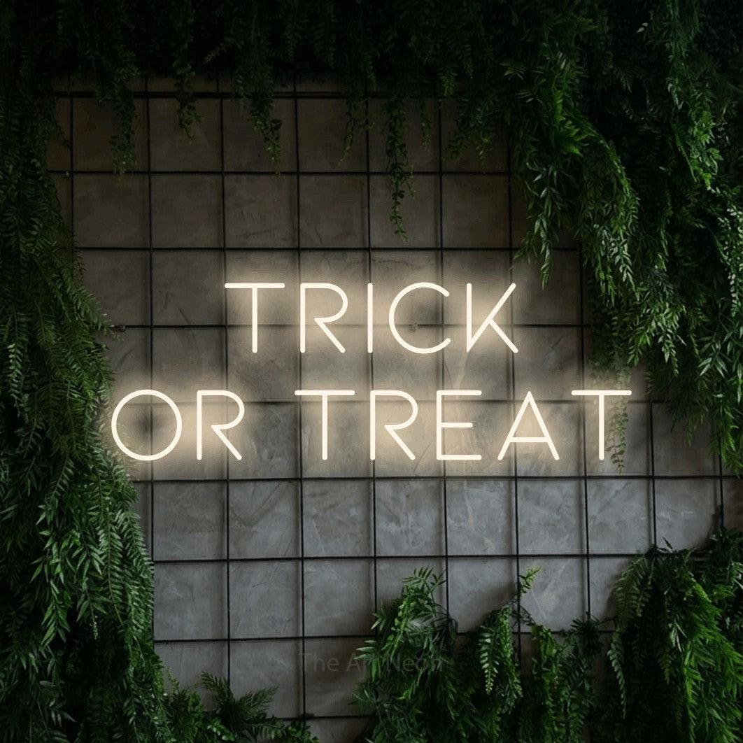 LED neon sign reading “TRICK OR TREAT”, arranged in 2 lines.