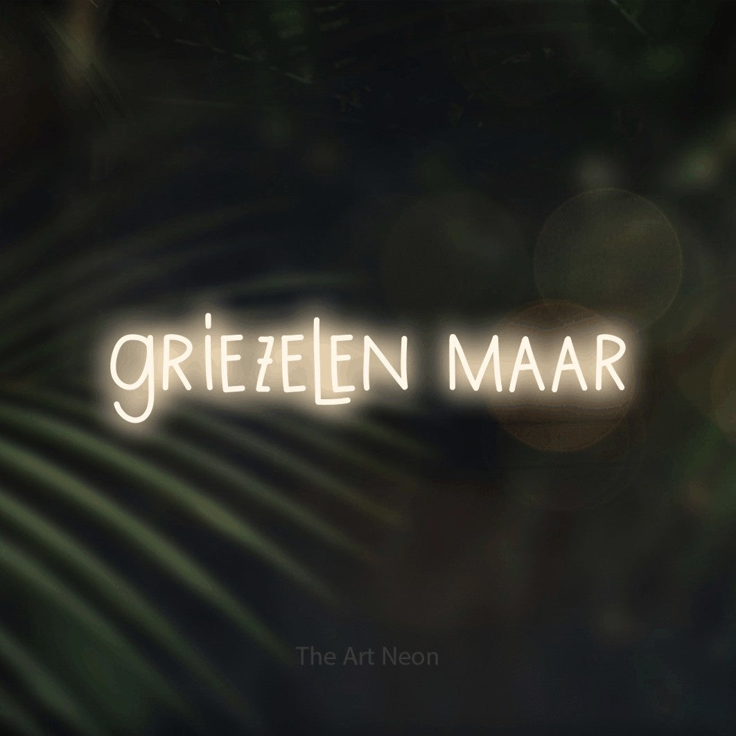 LED neon sign reading “griezelen maar”, arranged in a single line.