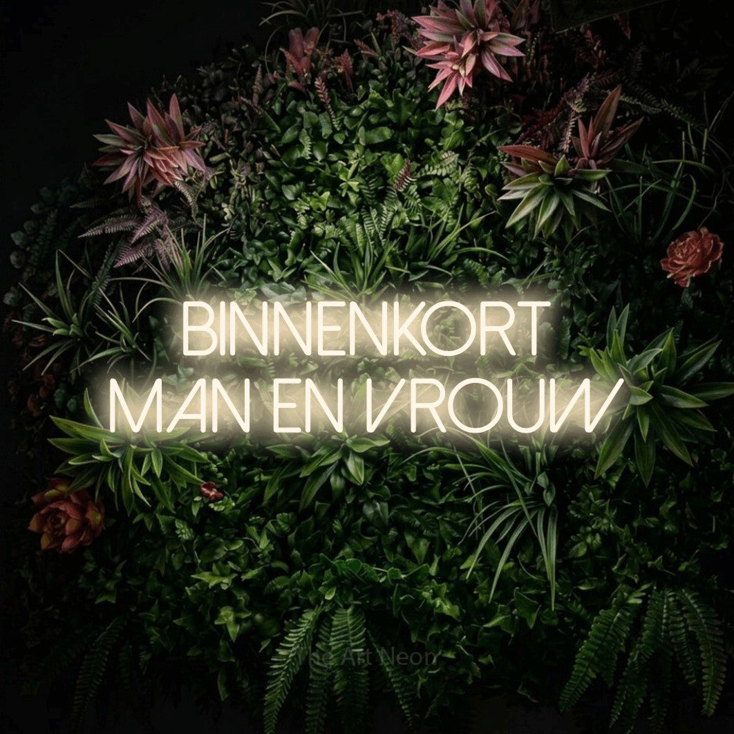 LED neon sign reading “Binnenkort Man En Vrouw”, arranged in 2 lines.