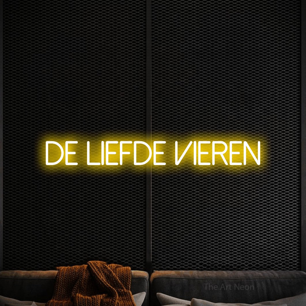 LED neon sign reading “De Liefde Vieren”, arranged in a single line.