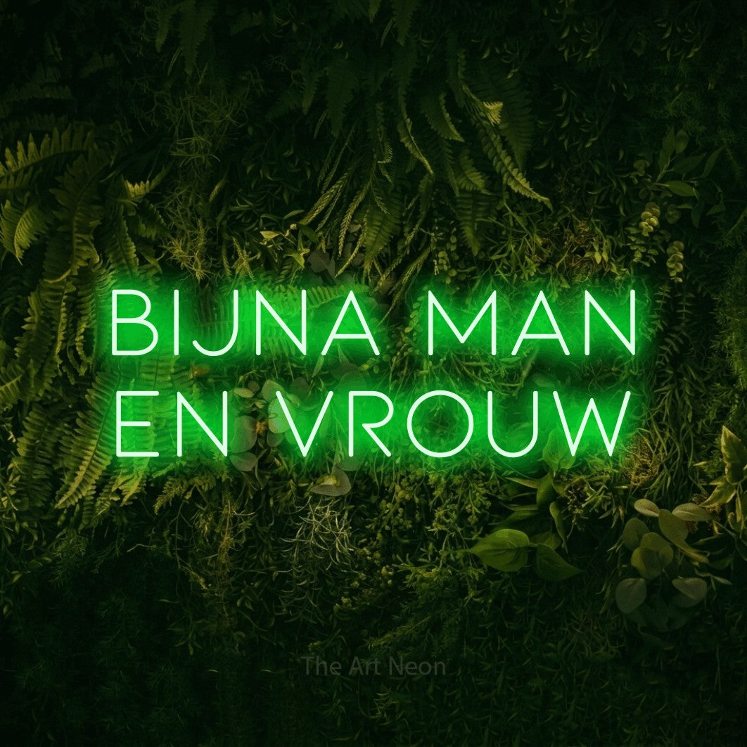 LED neon sign reading “BIJNA man en vrouw”, arranged in 2 lines.