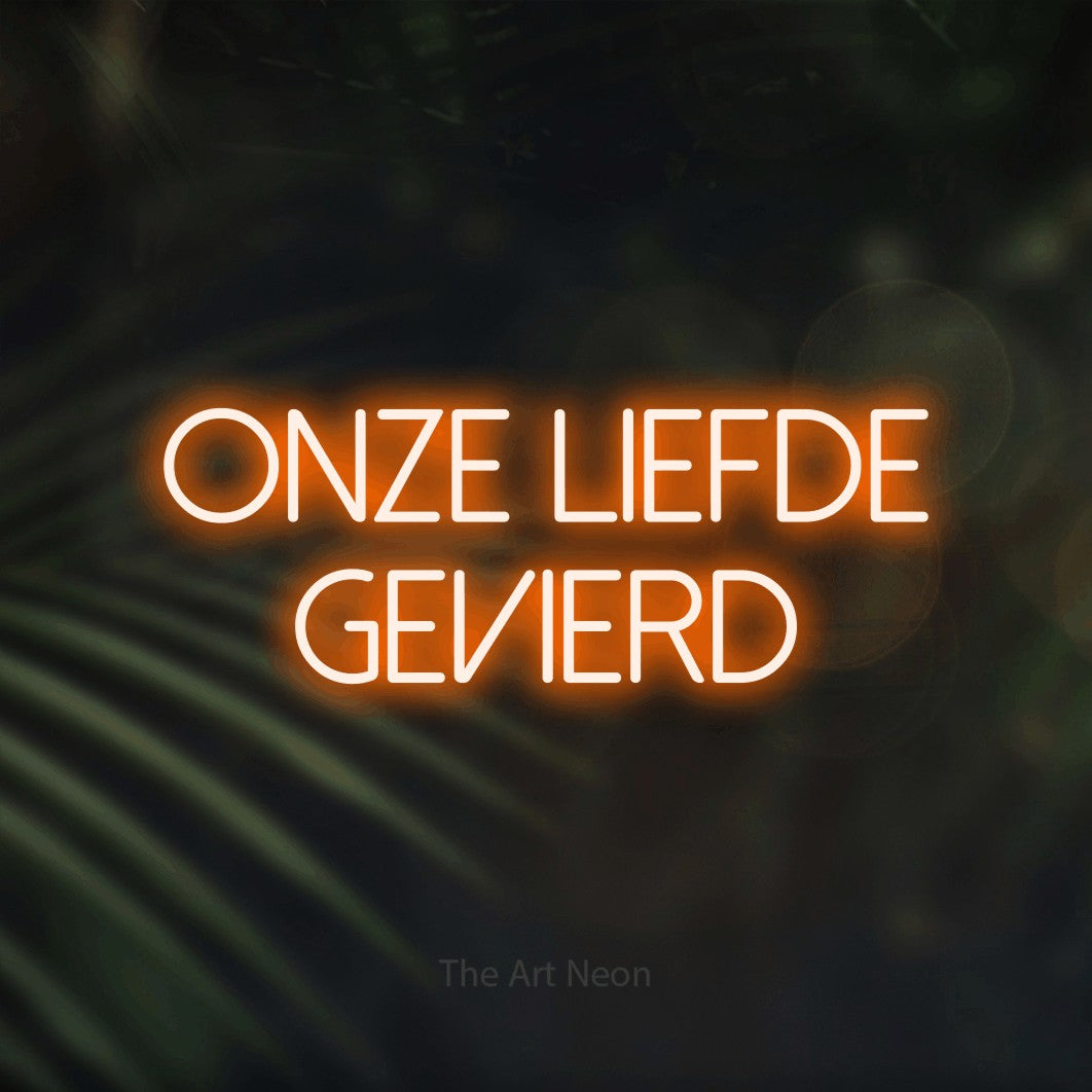 LED neon sign reading “ONZE liefde gevierd”, arranged in 2 lines.