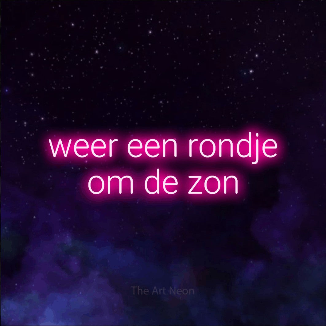 LED neon sign reading “weer een rondje om de zon”, arranged in 2 lines.