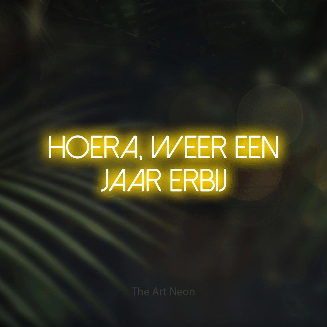 LED neon sign reading “HOERA, WEER EEN JAAR ERBIJ”, arranged in 2 lines.