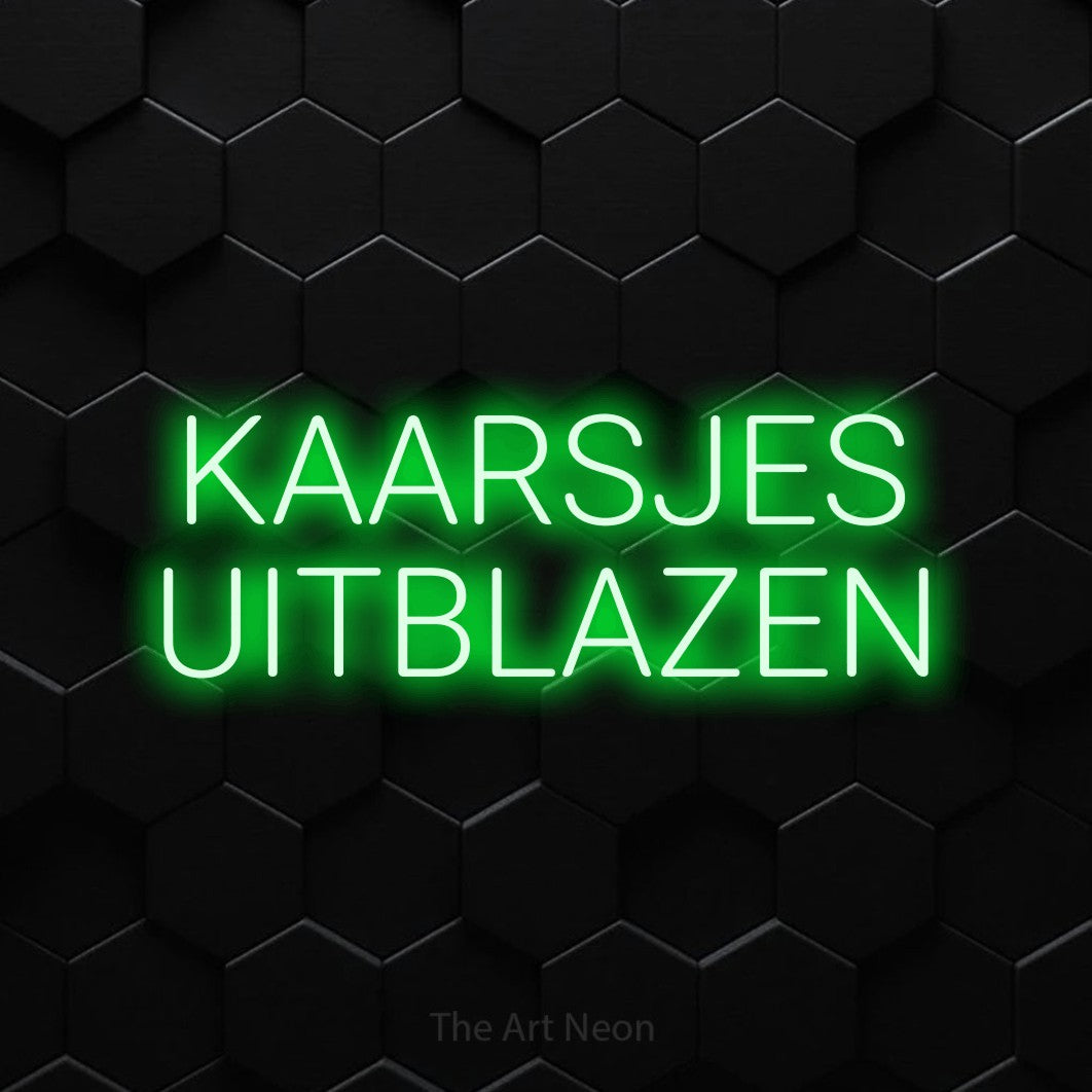 LED neon sign reading “KAARSJES UITBLAZEN”, arranged in 2 lines.
