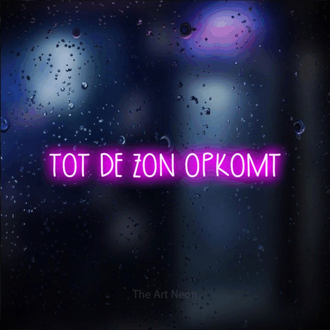 LED neon sign reading “TOT DE ZON OPKOMT”, arranged in a single line.