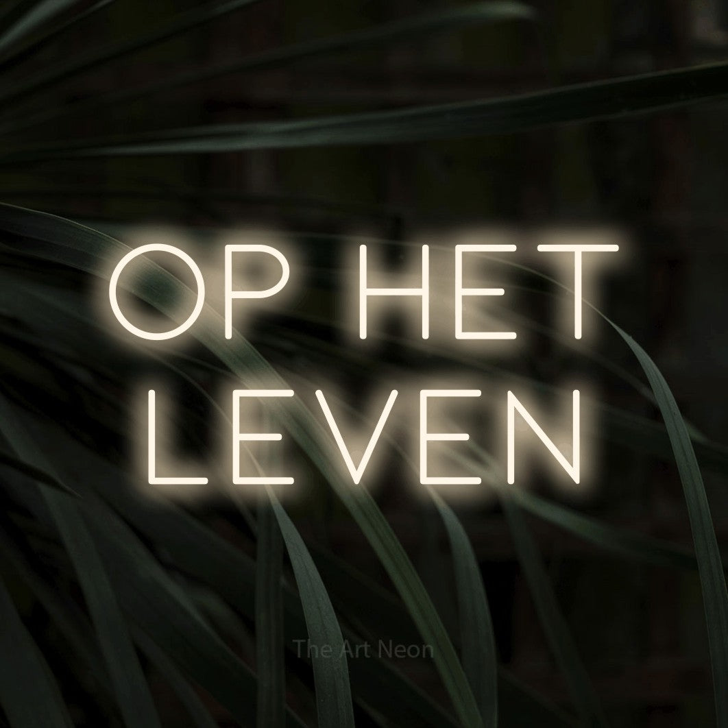 LED neon sign reading “op het leven”, arranged in 2 lines.