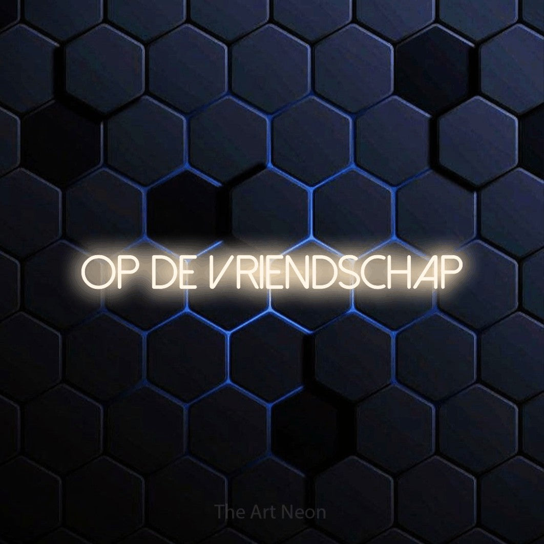 LED neon sign reading “OP DE VRIENDSCHAP”, arranged in a single line.