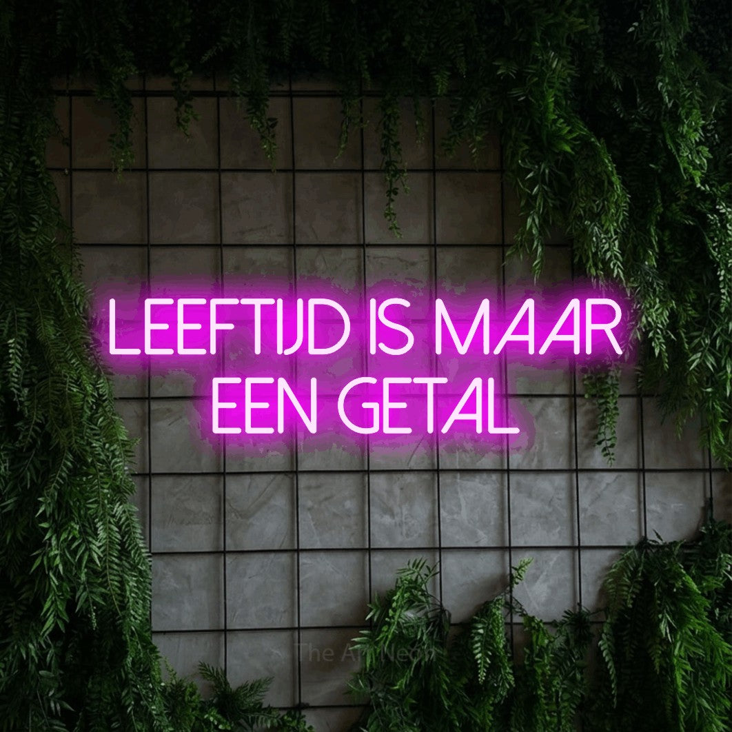 LED neon sign reading “LEEFTIJD is maar een getal”, arranged in 2 lines.