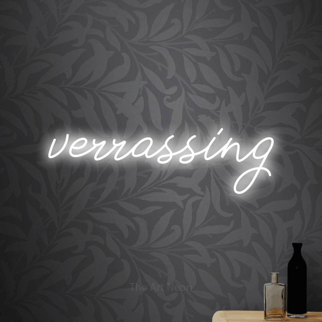 LED neon sign reading “verrassing”, arranged in a single line.