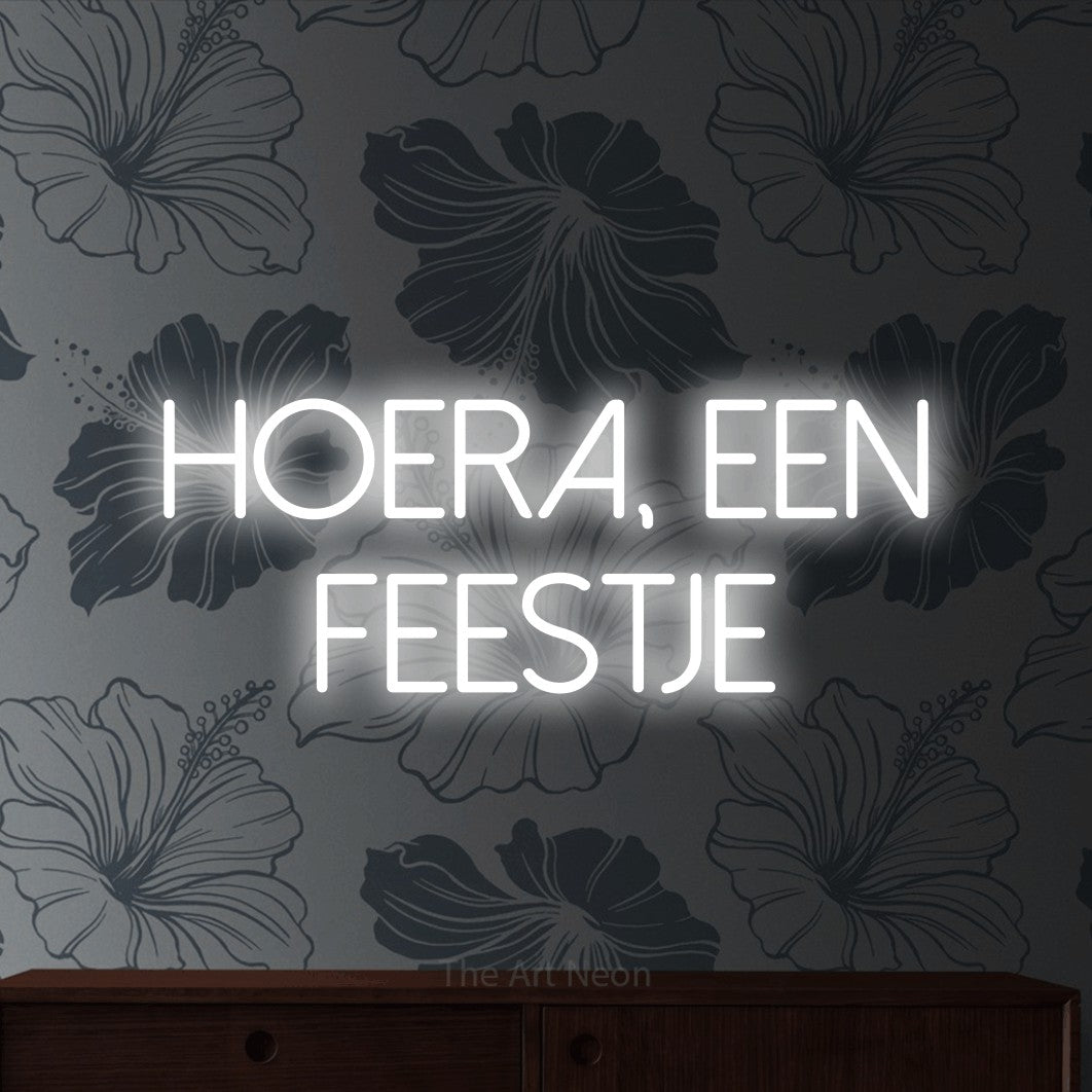 LED neon sign reading “HOERA, EEN FEESTJE”, arranged in 2 lines.
