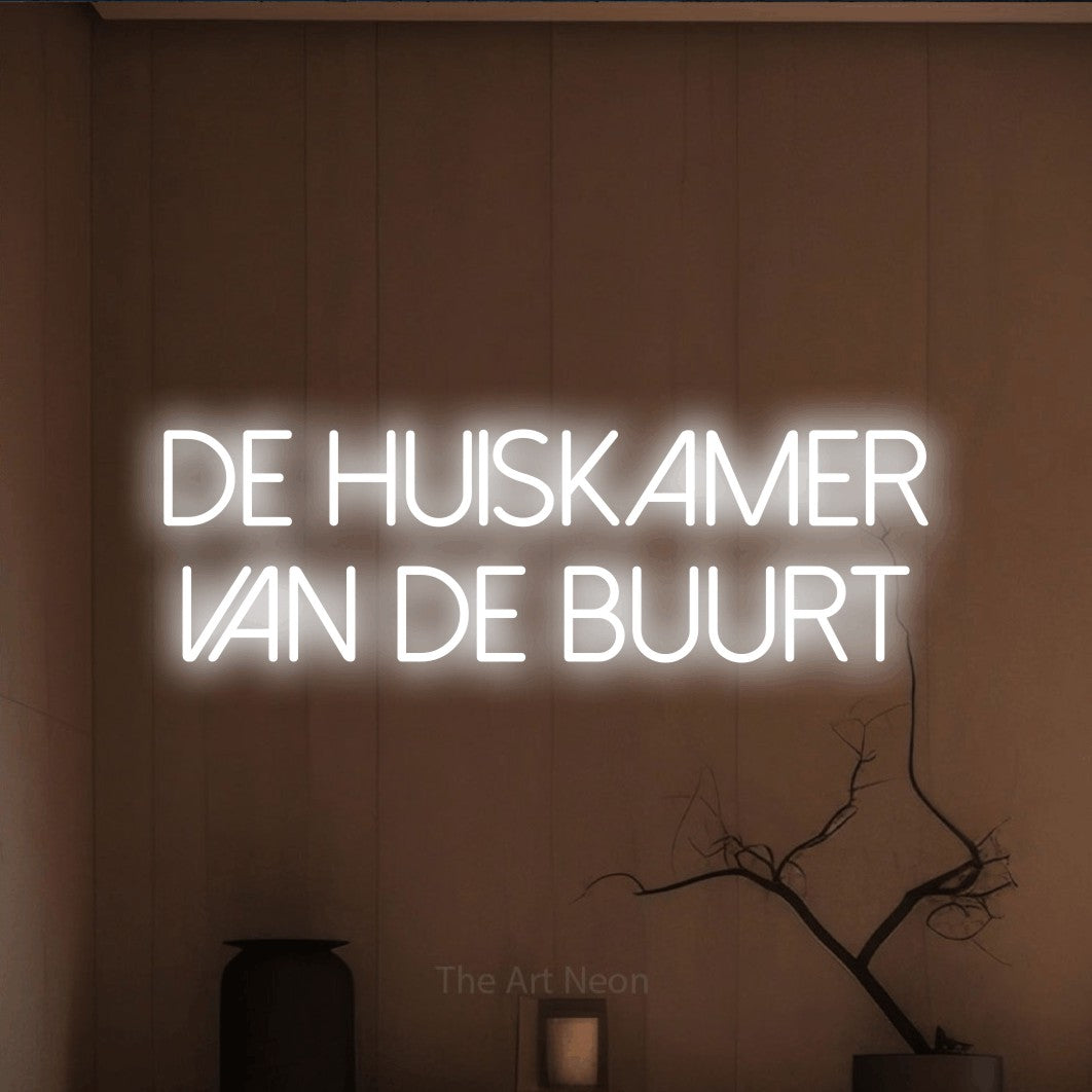 LED neon sign reading “De Huiskamer Van De Buurt”, arranged in 2 lines.