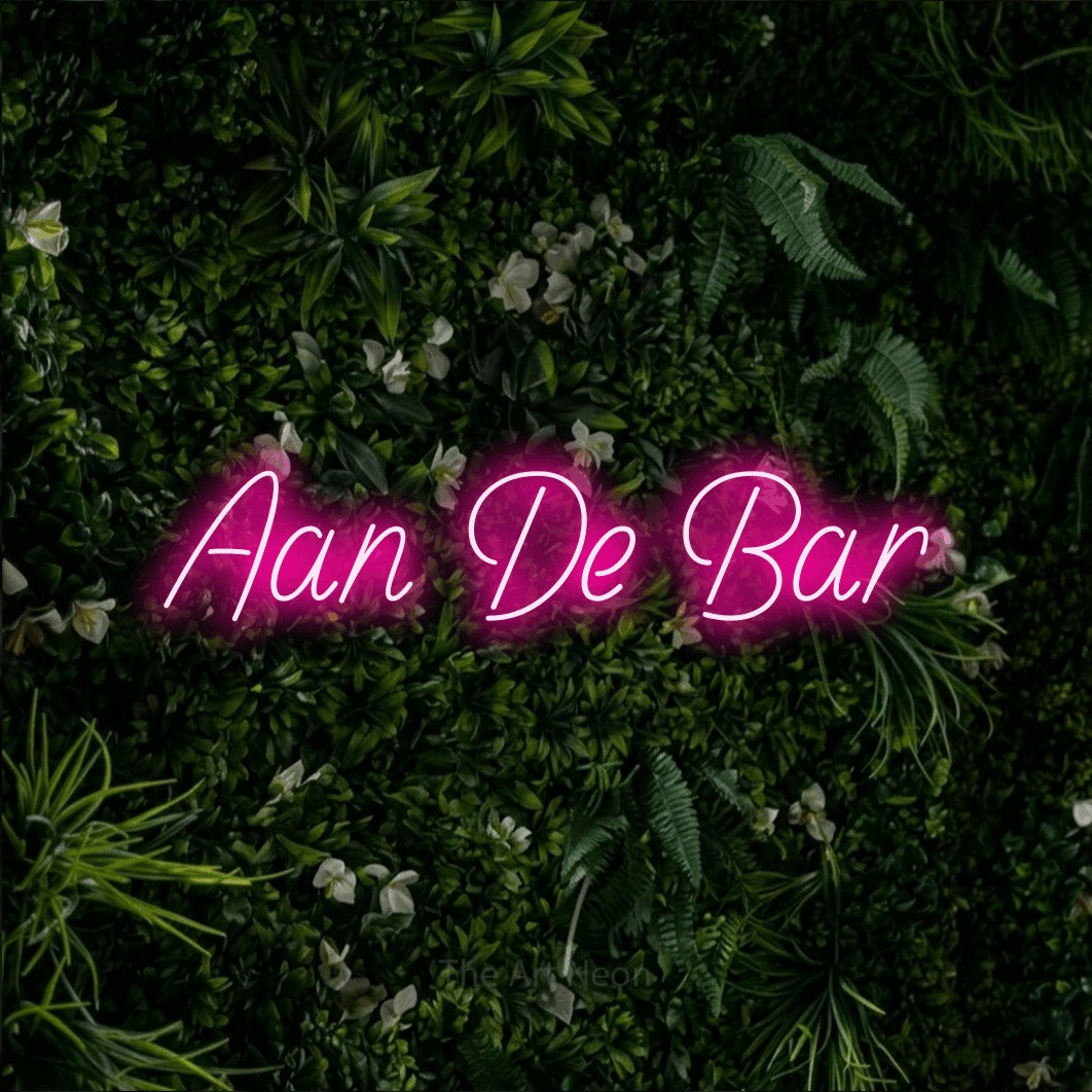 LED neon sign reading “Aan De Bar”, arranged in a single line.