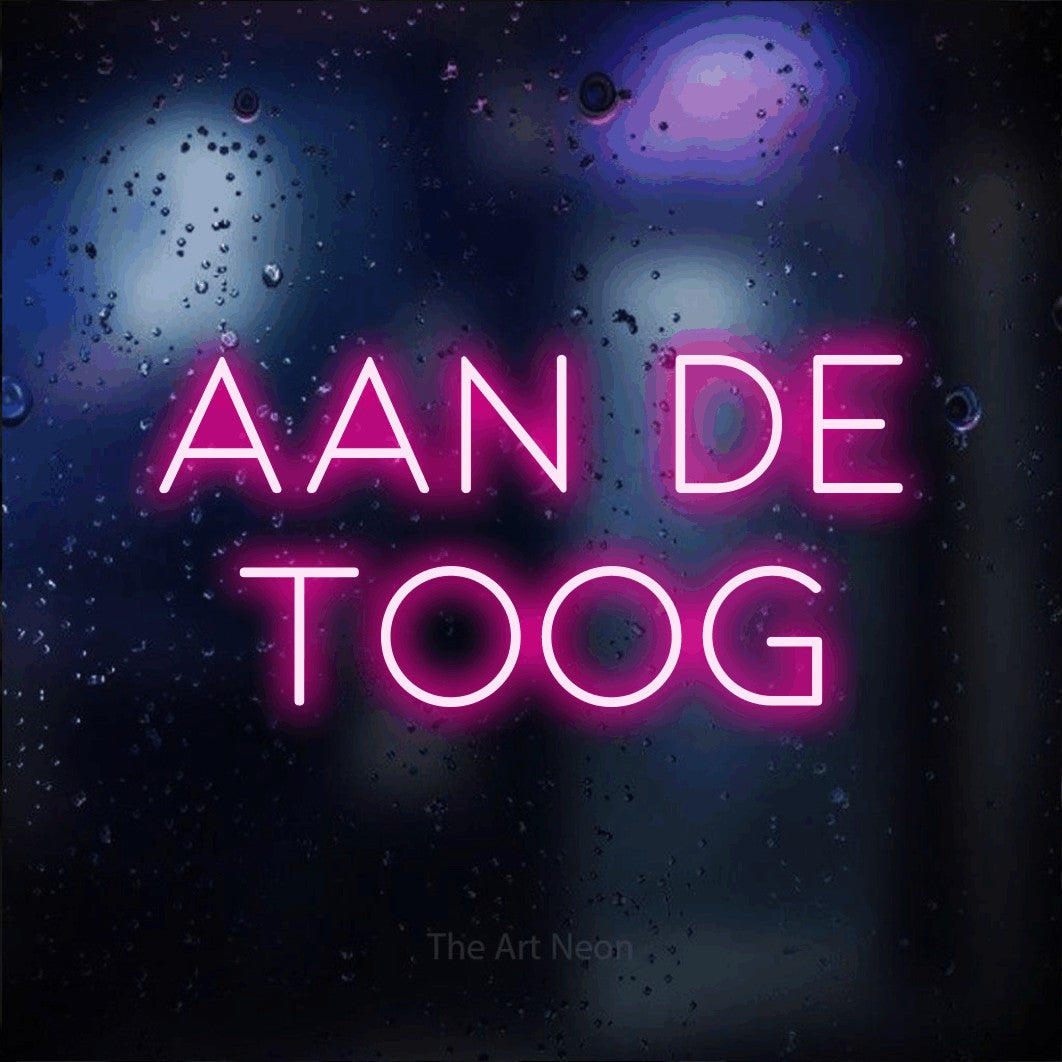LED neon sign reading “aan de toog”, arranged in 2 lines.