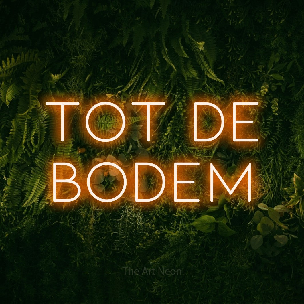 LED neon sign reading “tot de bodem”, arranged in 2 lines.