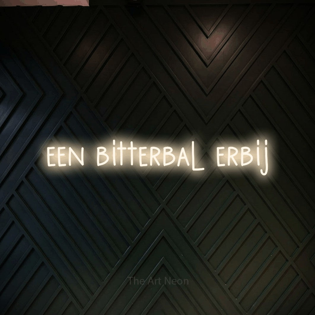 LED neon sign reading “een bitterbal erbij”, arranged in a single line.