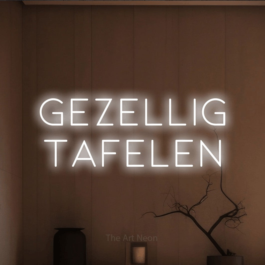 LED neon sign reading “gezellig tafelen”, arranged in 2 lines.