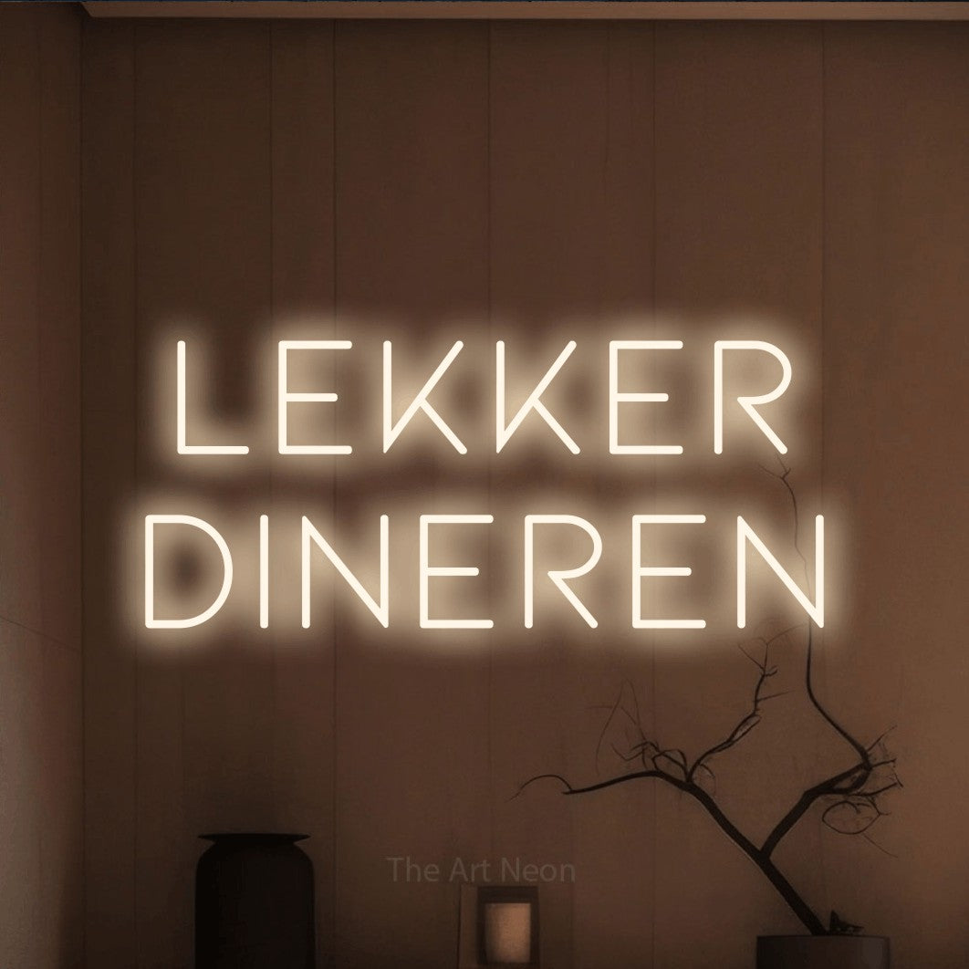 LED neon sign reading “Lekker Dineren”, arranged in 2 lines.