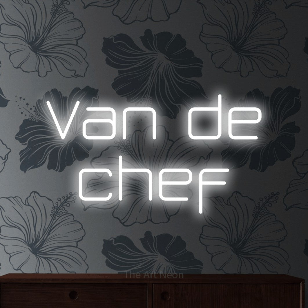 LED neon sign reading “Van de chef”, arranged in 2 lines.
