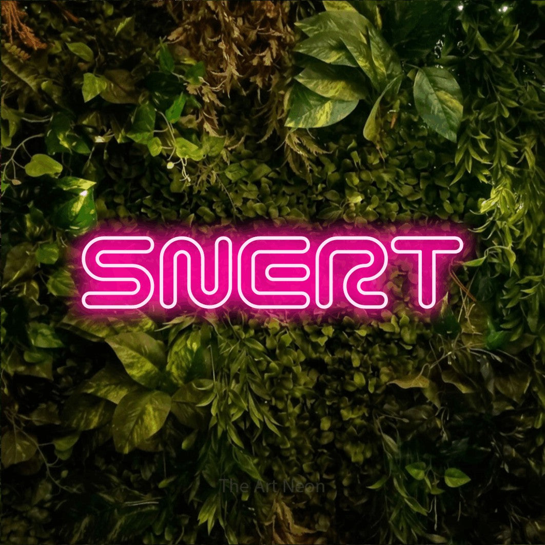LED neon sign reading “SNERT”, arranged in a single line.