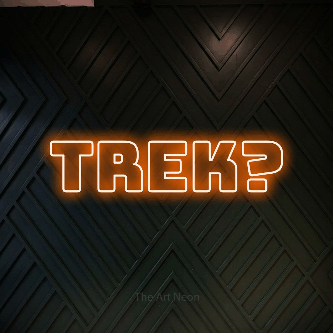LED neon sign reading “trek?”, arranged in a single line.