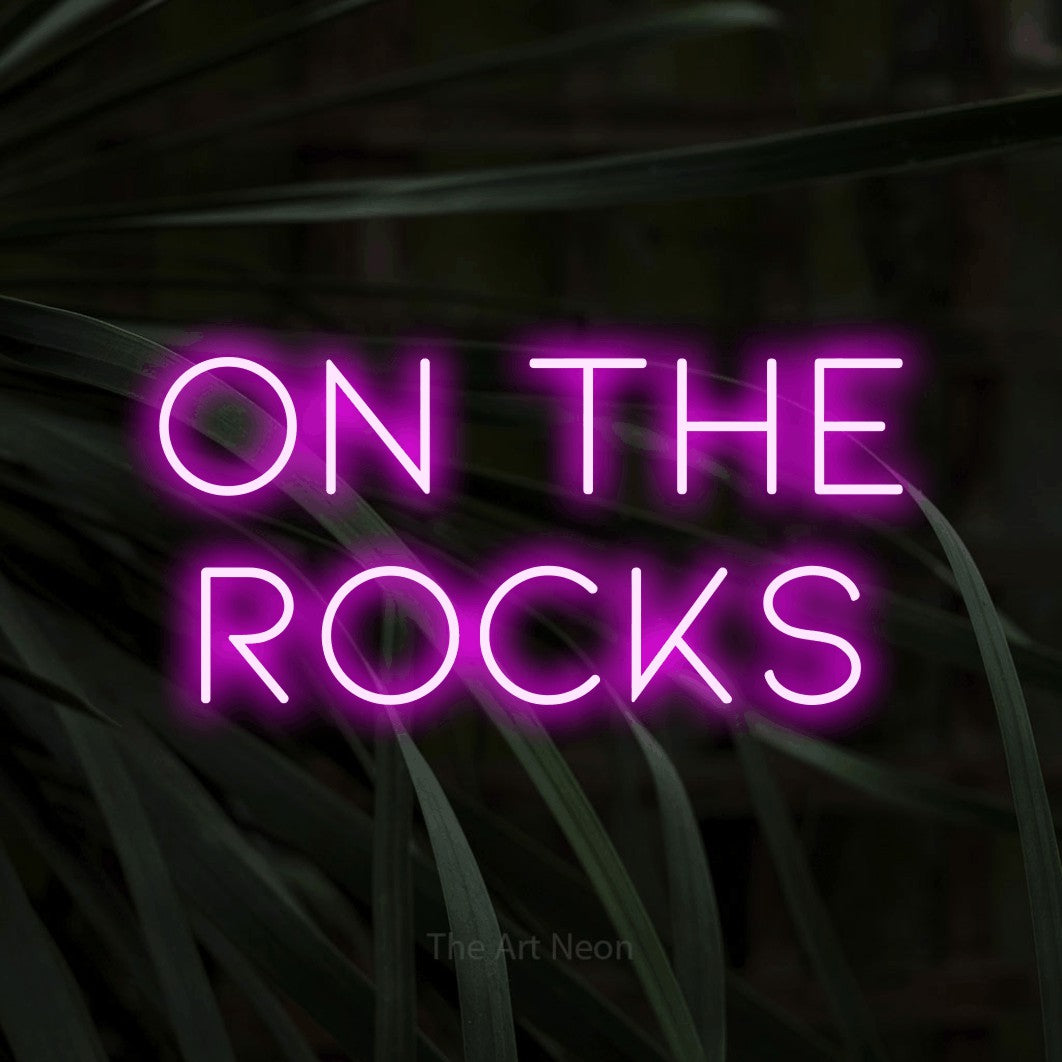LED neon sign reading “on the rocks”, arranged in 2 lines.
