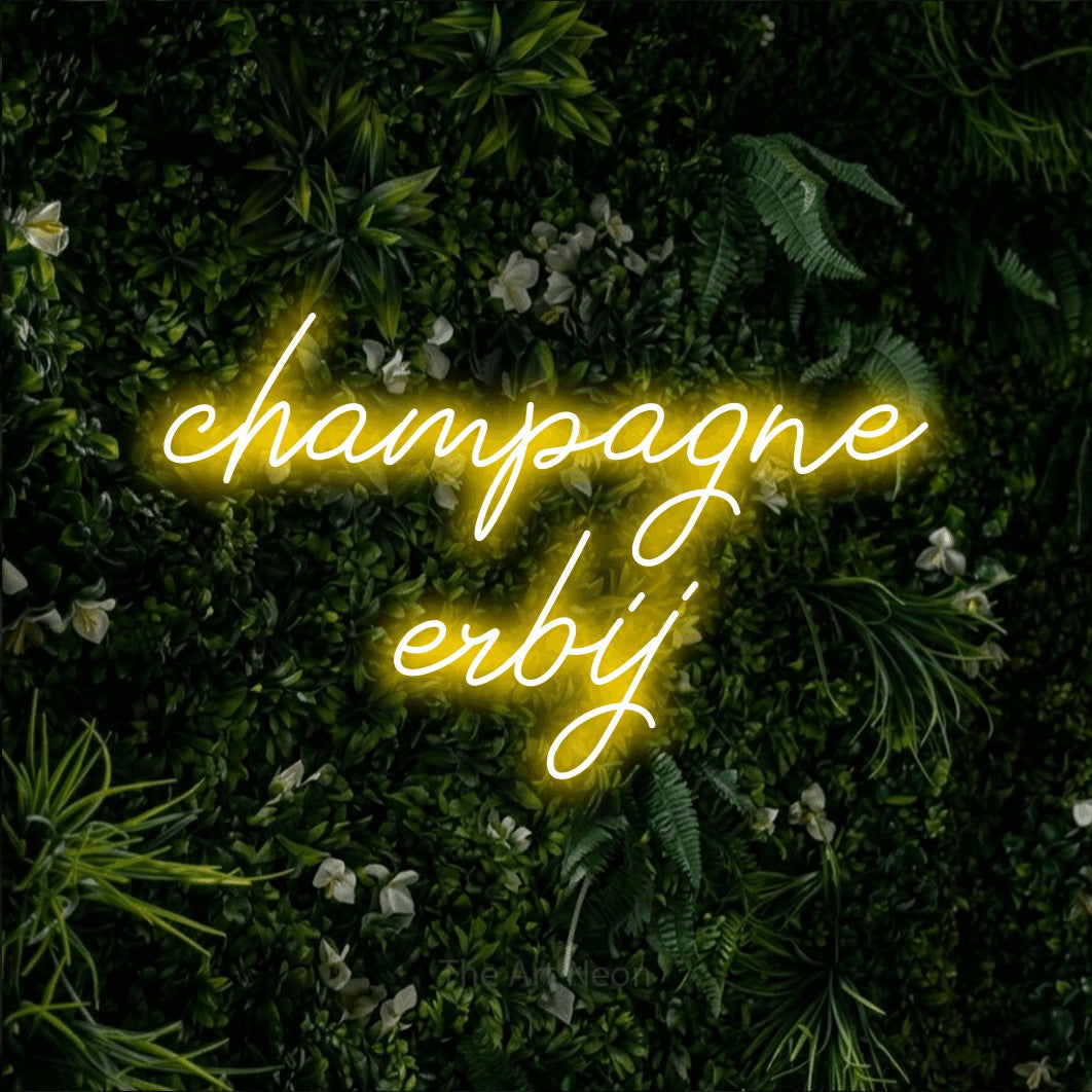 LED neon sign reading “champagne erbij”, arranged in 2 lines.