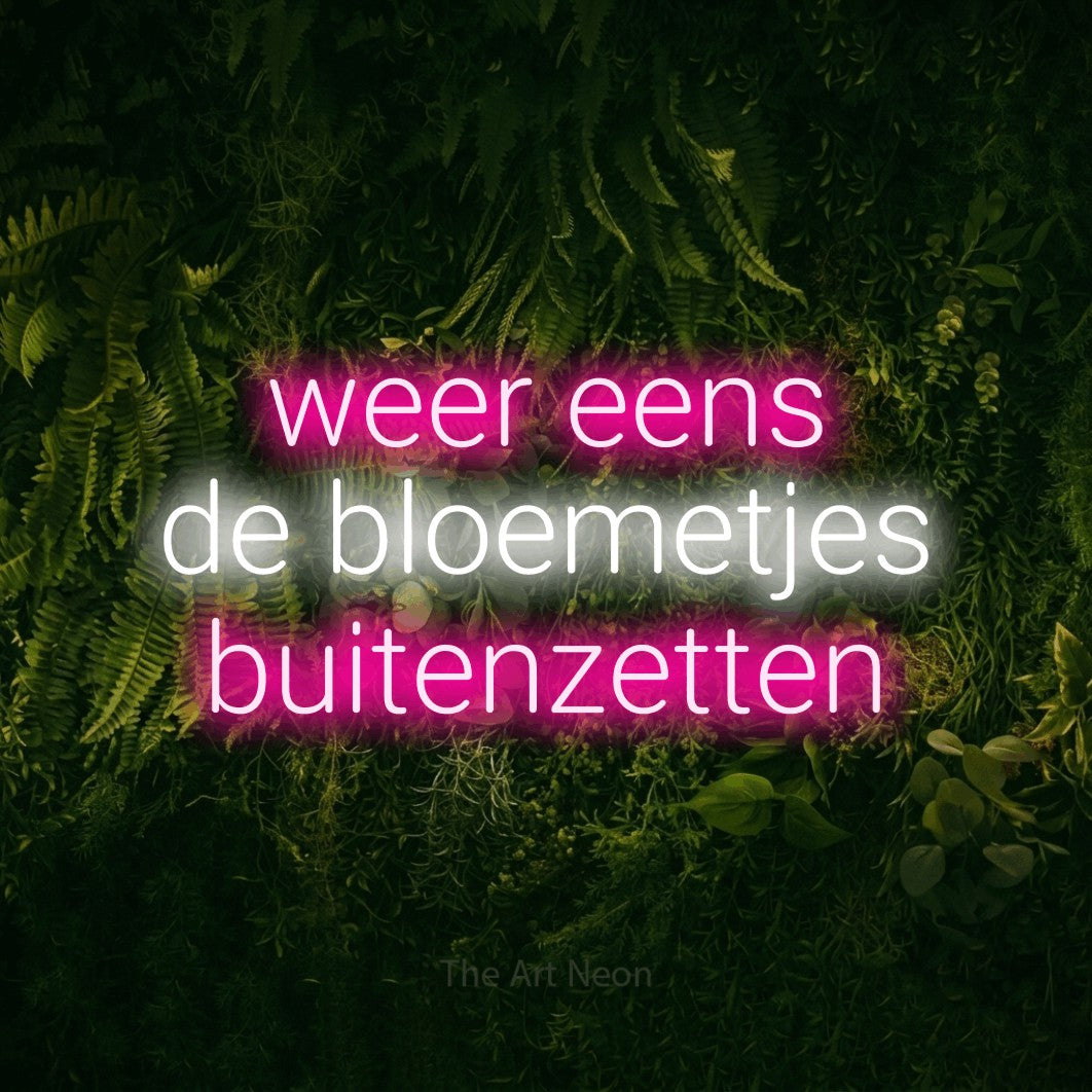 LED neon sign reading “weer eens de bloemetjes buitenzetten”, arranged in 3 lines.