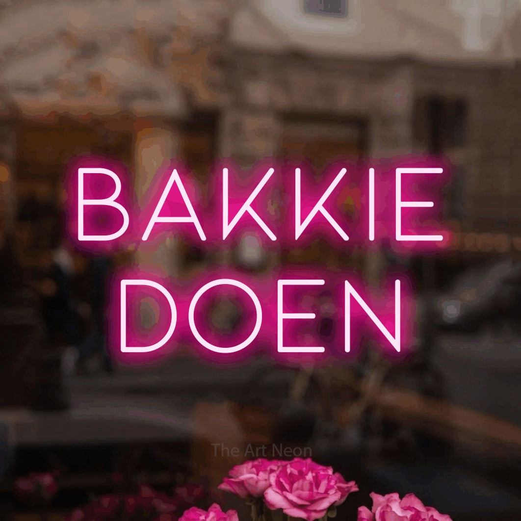 LED neon sign reading “bakkie doen”, arranged in 2 lines.
