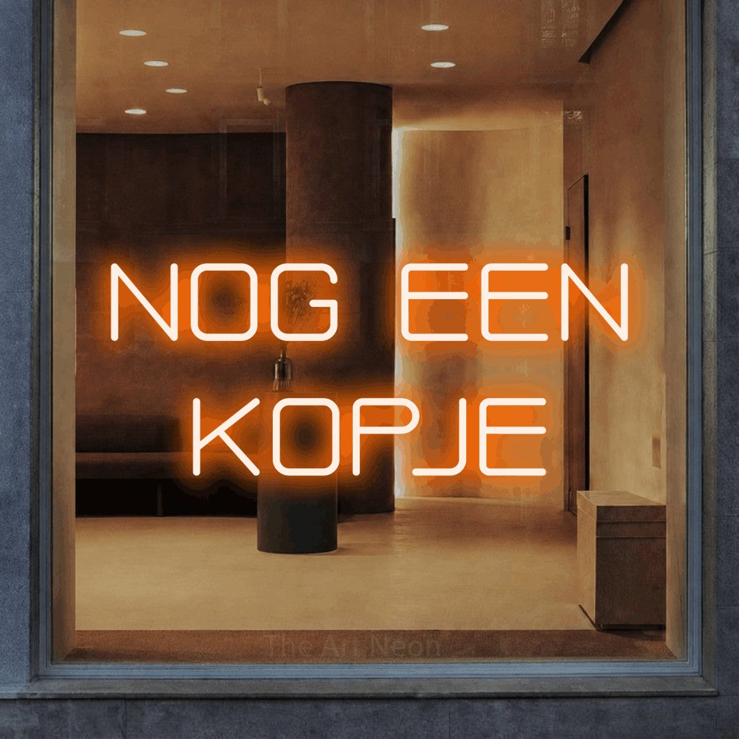 LED neon sign reading “NOG EEN KOPJE”, arranged in 2 lines.