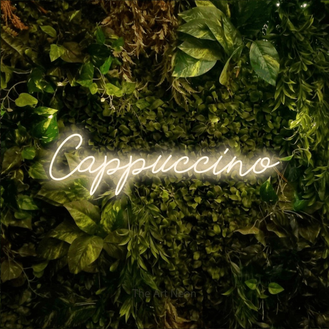 LED neon sign reading “Cappuccino”, arranged in a single line.