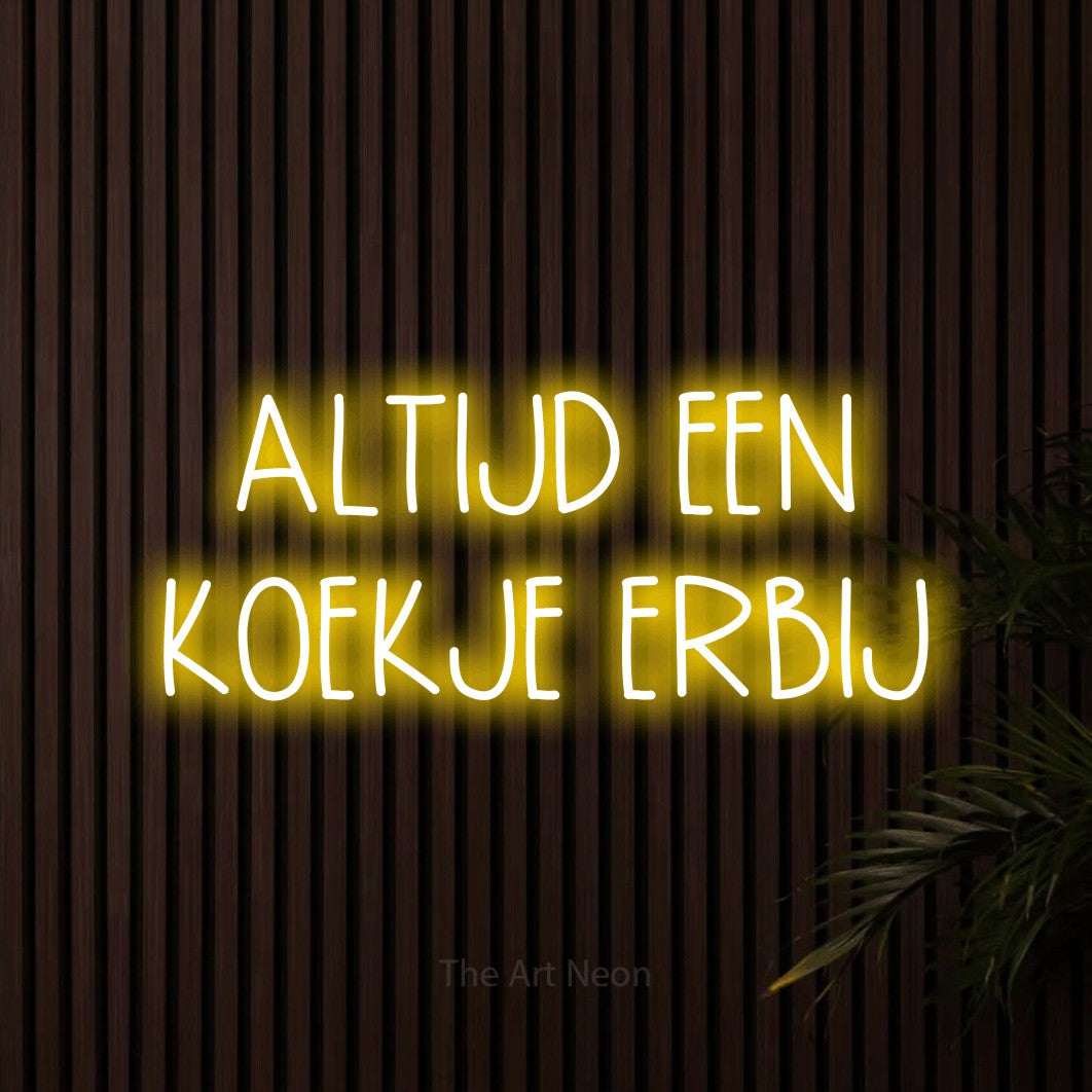 LED neon sign reading “ALTIJD EEN KOEKJE ERBIJ”, arranged in 2 lines.