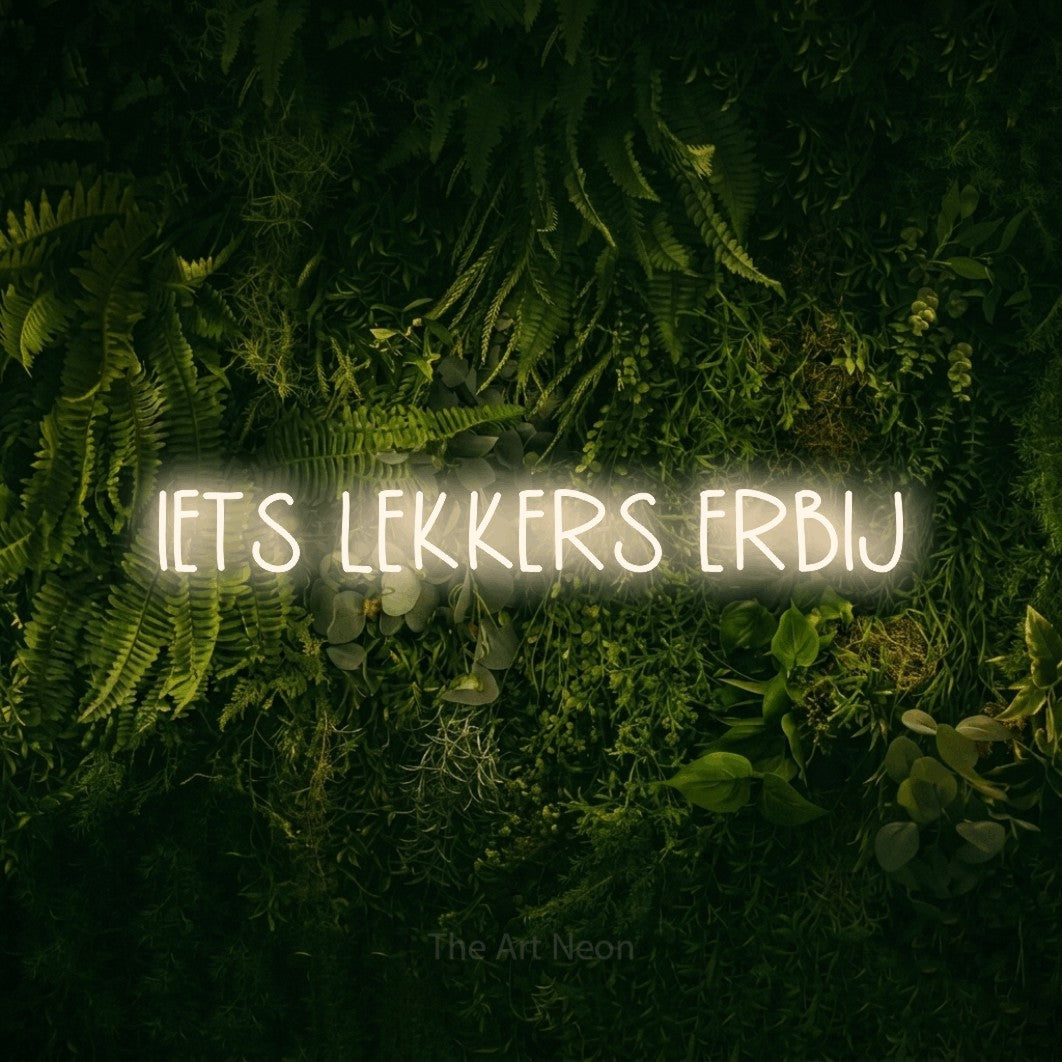LED neon sign reading “IETS LEKKERS ERBIJ”, arranged in a single line.
