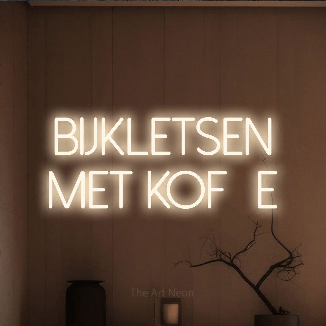 LED neon sign reading “Bijkletsen met koffie”, arranged in 2 lines.