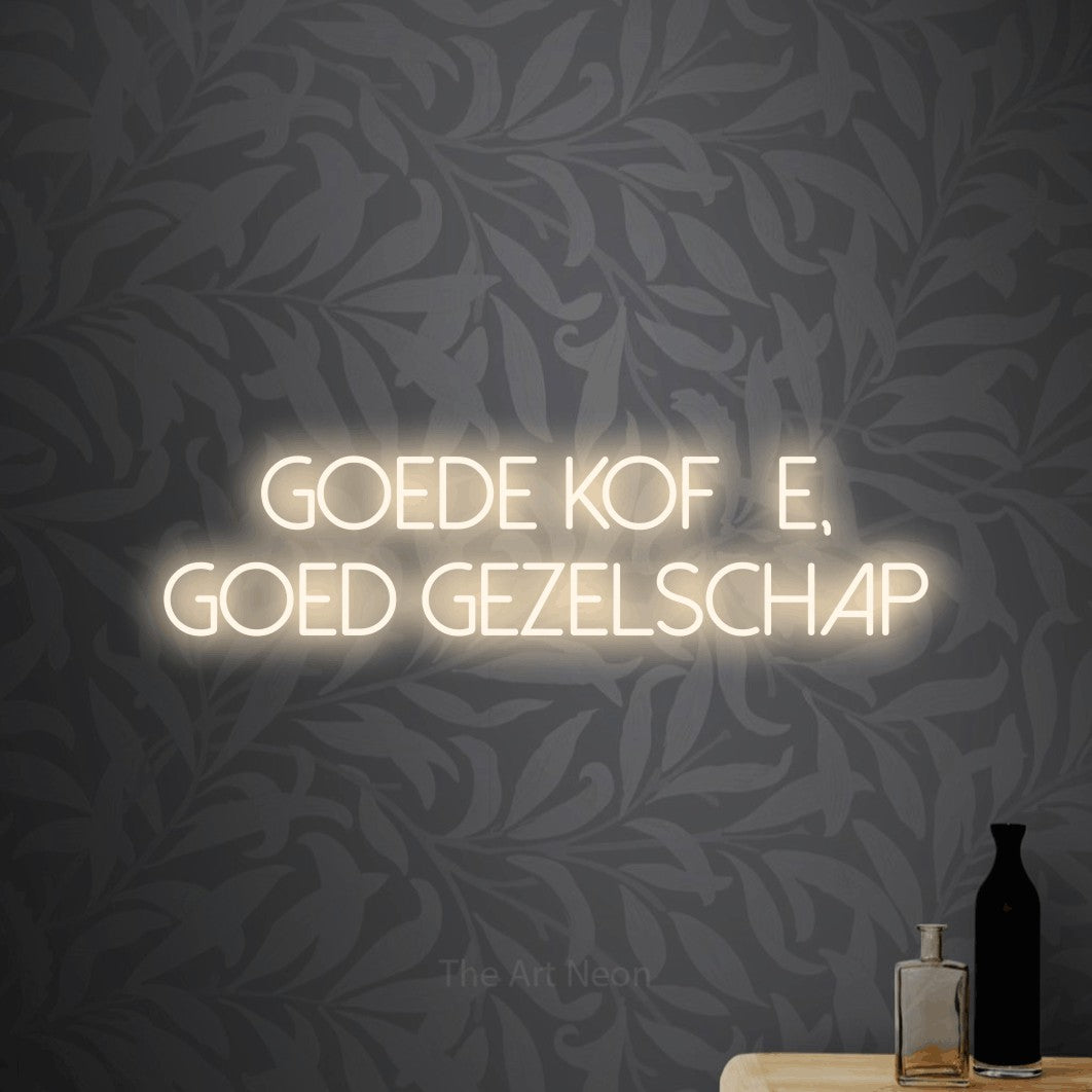 LED neon sign reading “Goede Koffie, Goed Gezelschap”, arranged in 2 lines.