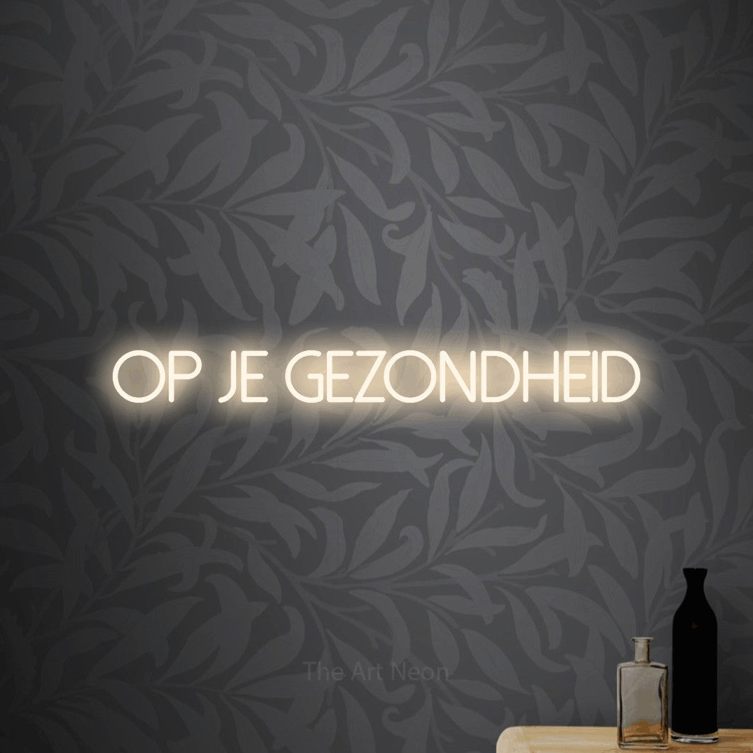 LED neon sign reading “Op Je Gezondheid”, arranged in a single line.