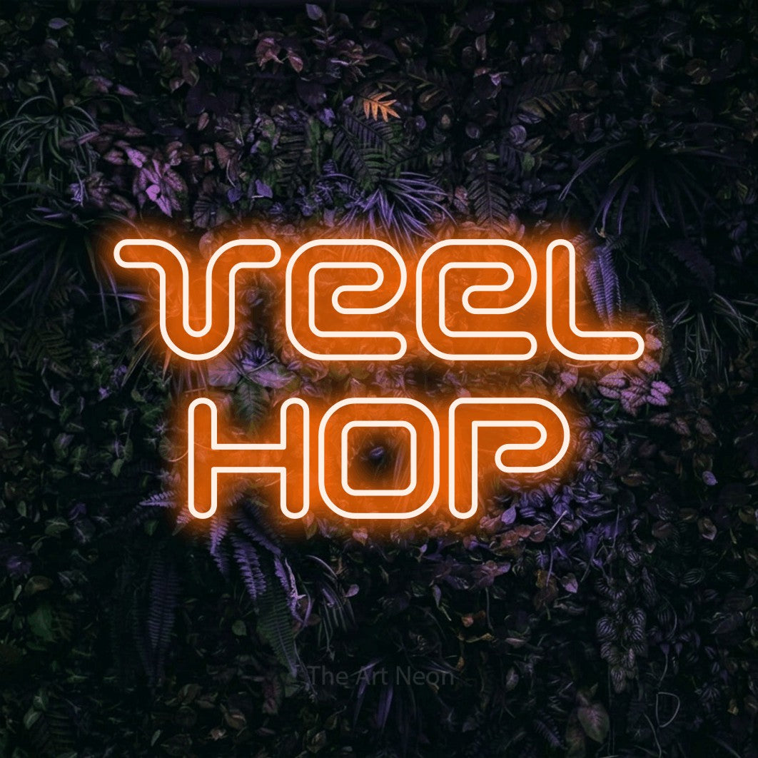 LED neon sign reading “Veel Hop”, arranged in 2 lines.