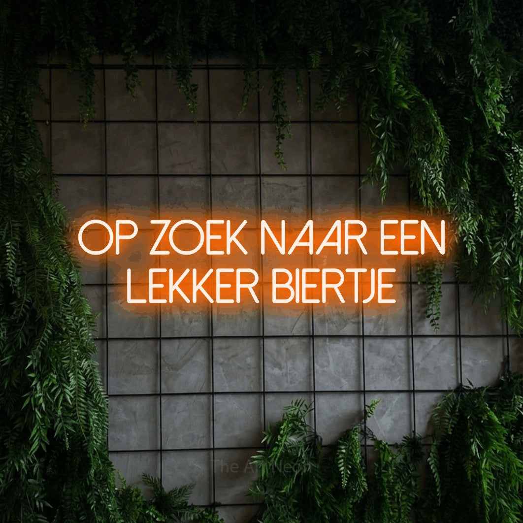 LED neon sign reading “Op Zoek Naar Een Lekker Biertje”, arranged in 2 lines.