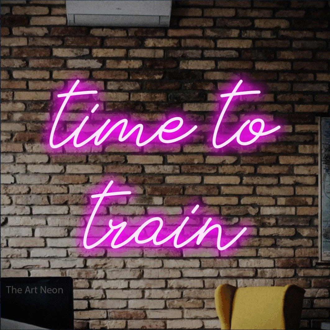 LED neon sign reading “time to train”, arranged in 2 lines.