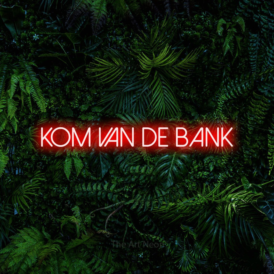 LED neon sign reading “KOM van de bank”, arranged in a single line.