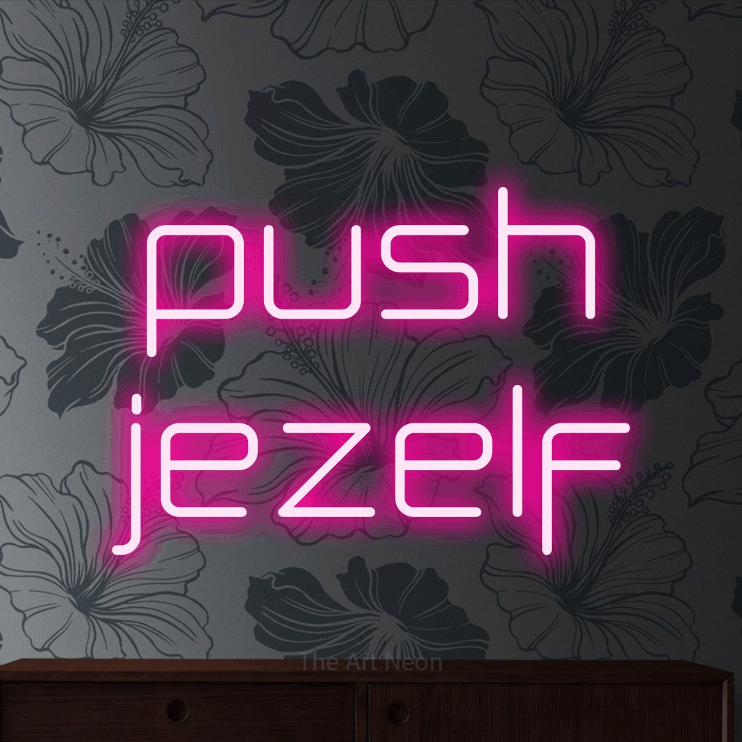 LED neon sign reading “push jezelf”, arranged in 2 lines.