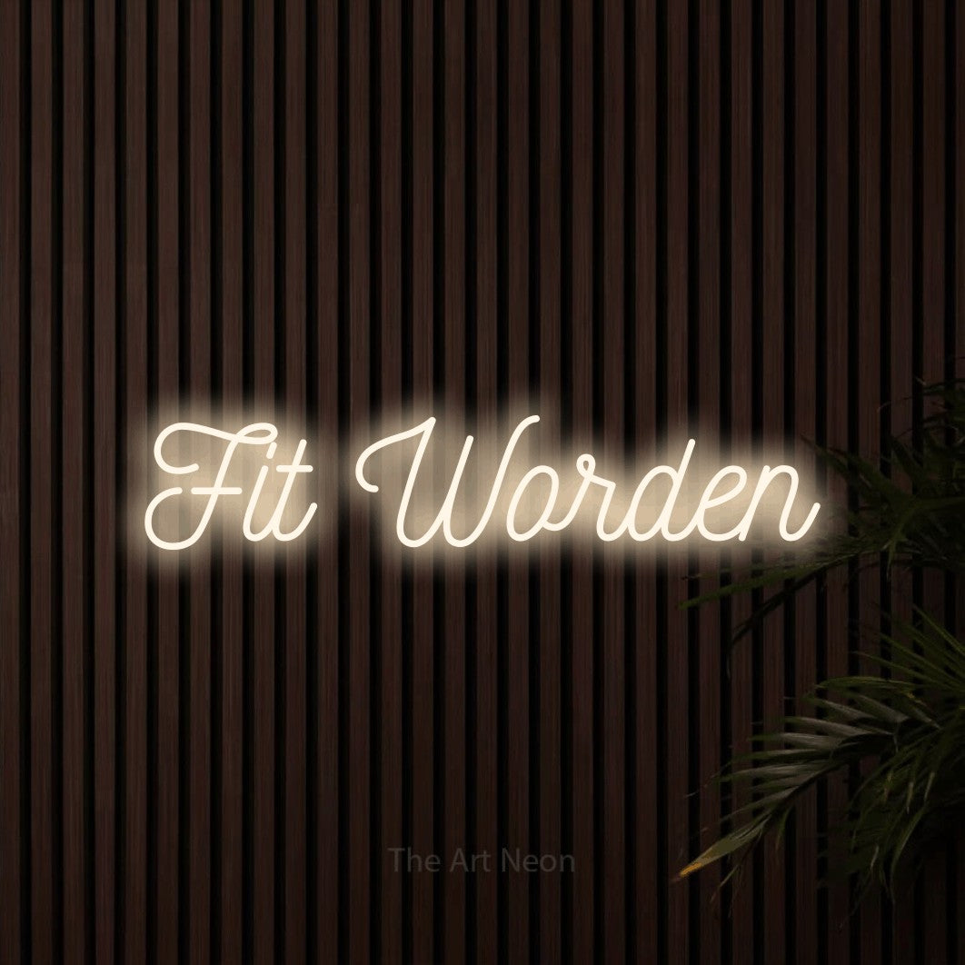 LED neon sign reading “Fit Worden”, arranged in a single line.