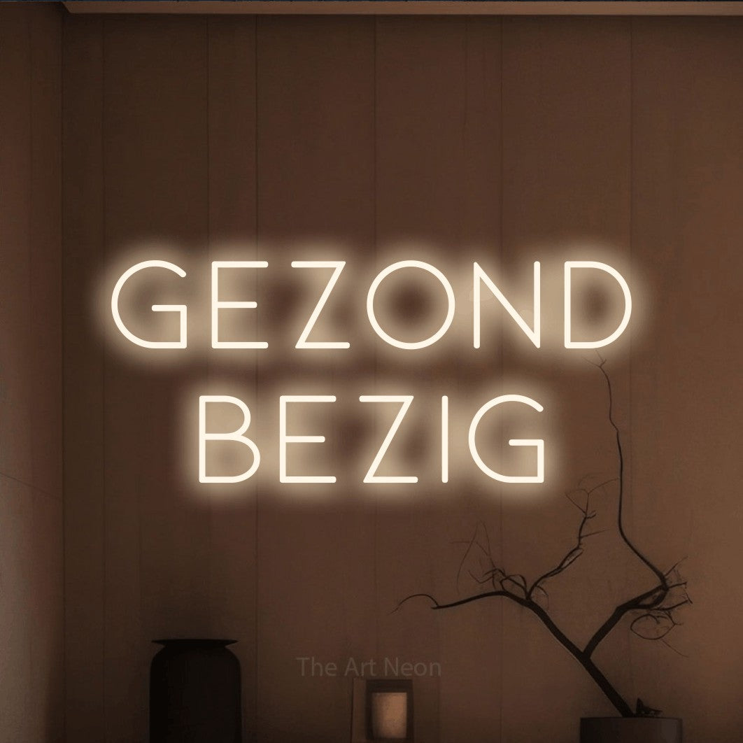 LED neon sign reading “Gezond Bezig”, arranged in 2 lines.