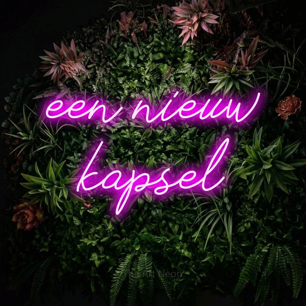 LED neon sign reading “een nieuw kapsel”, arranged in 2 lines.