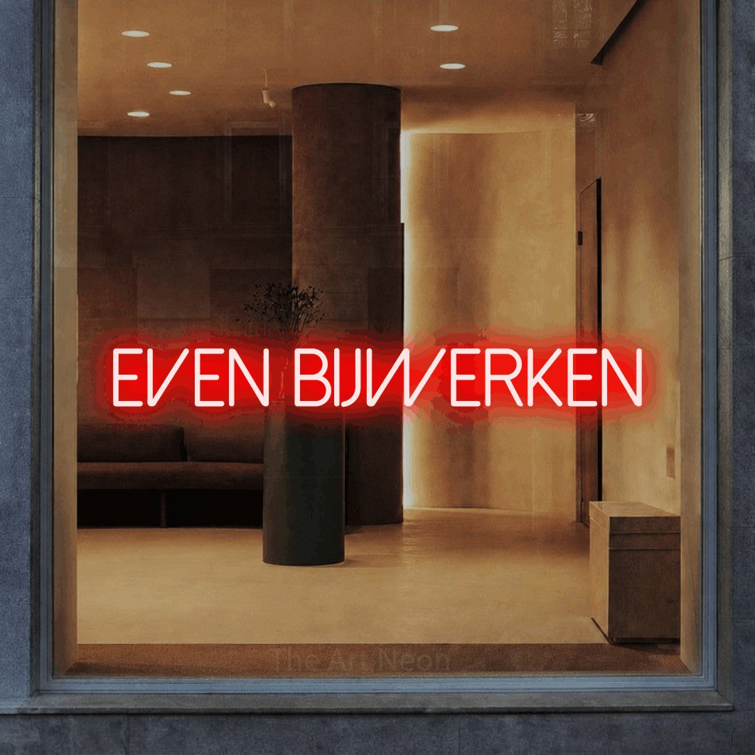 LED neon sign reading “EVEN BIJWERKEN”, arranged in a single line.