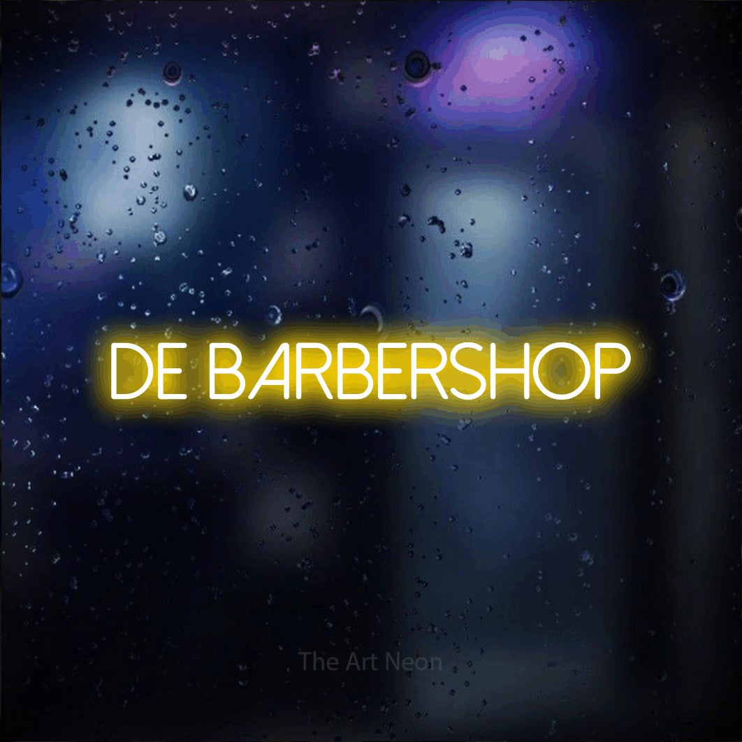 LED neon sign reading “De barbershop”, arranged in a single line.
