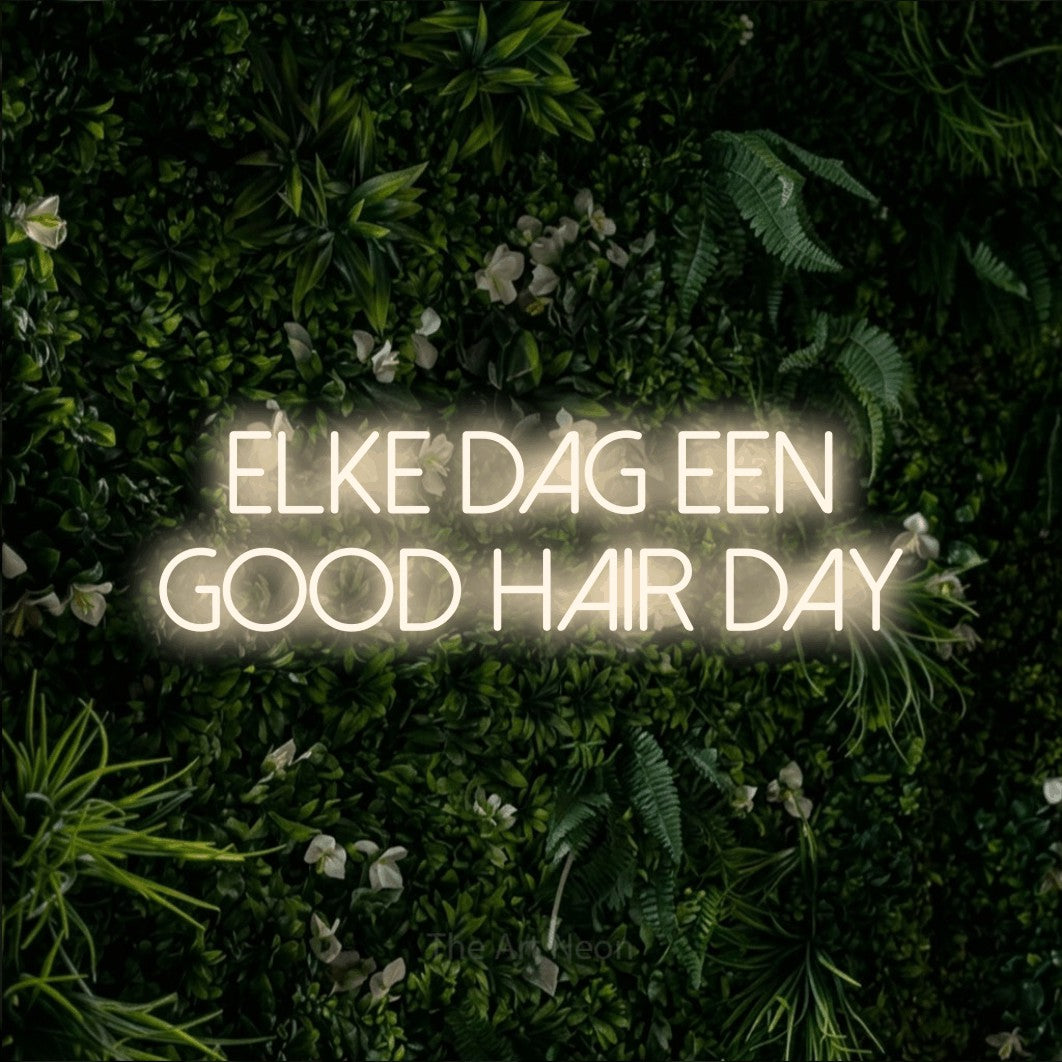 LED neon sign reading “elke dag een good hair day”, arranged in 2 lines.