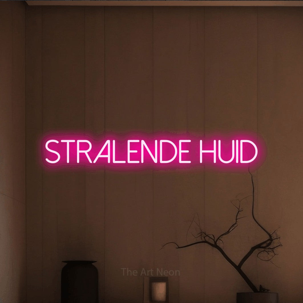 LED neon sign reading “Stralende Huid”, arranged in a single line.