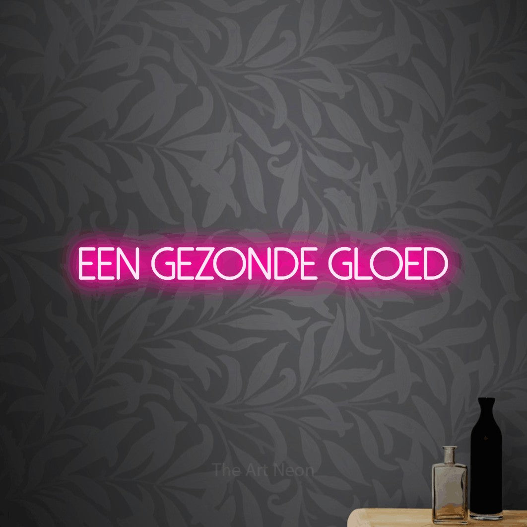 LED neon sign reading “een gezonde gloed”, arranged in a single line.