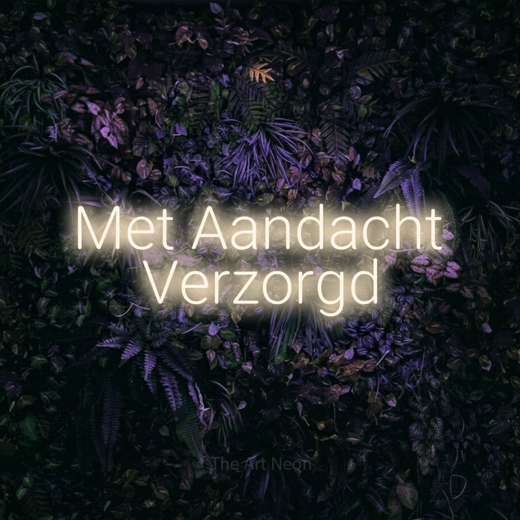 LED neon sign reading “Met Aandacht Verzorgd”, arranged in 2 lines.